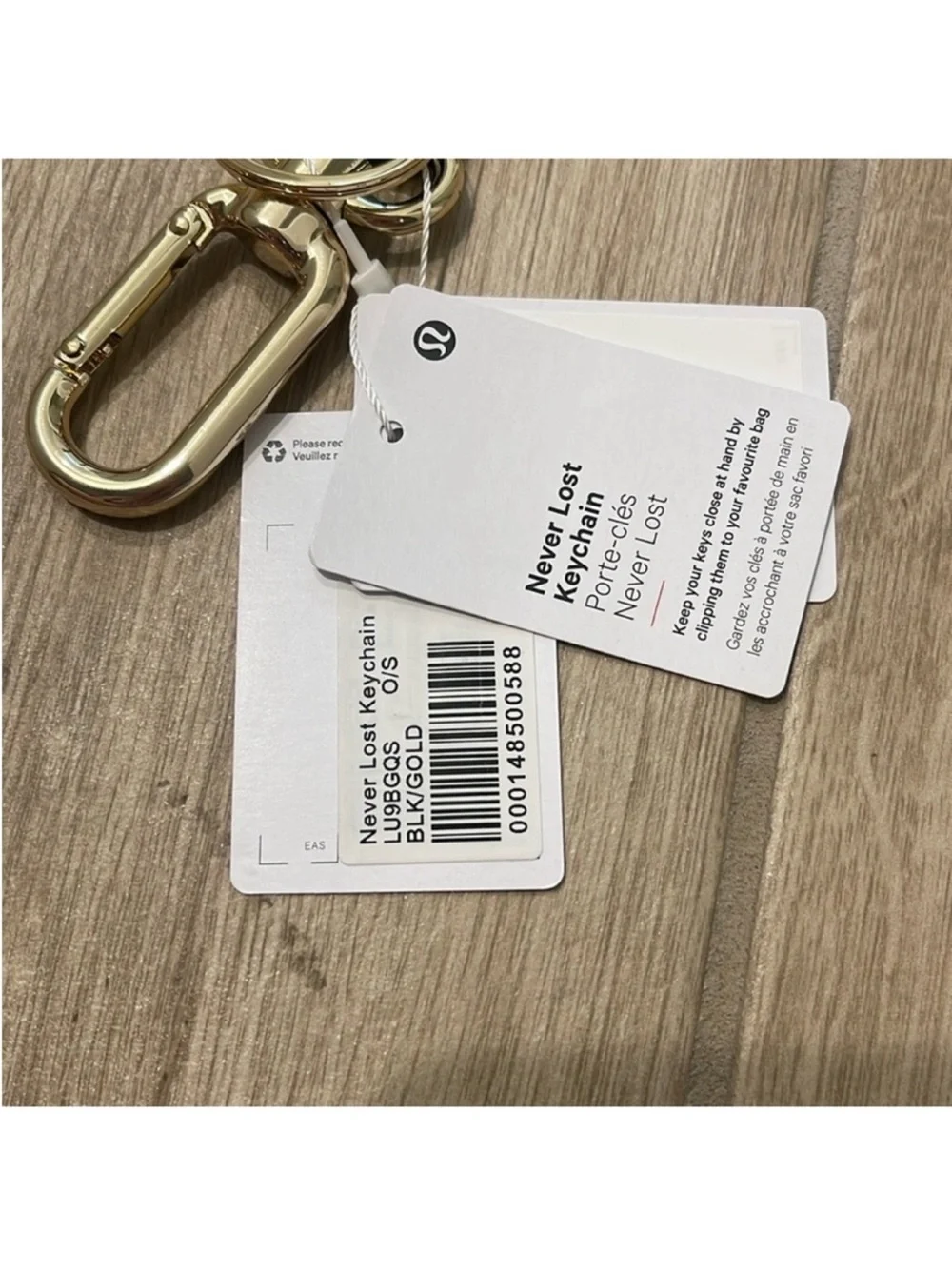 NWT Never Lost Keychain Black/ Gold Wordmark O/S